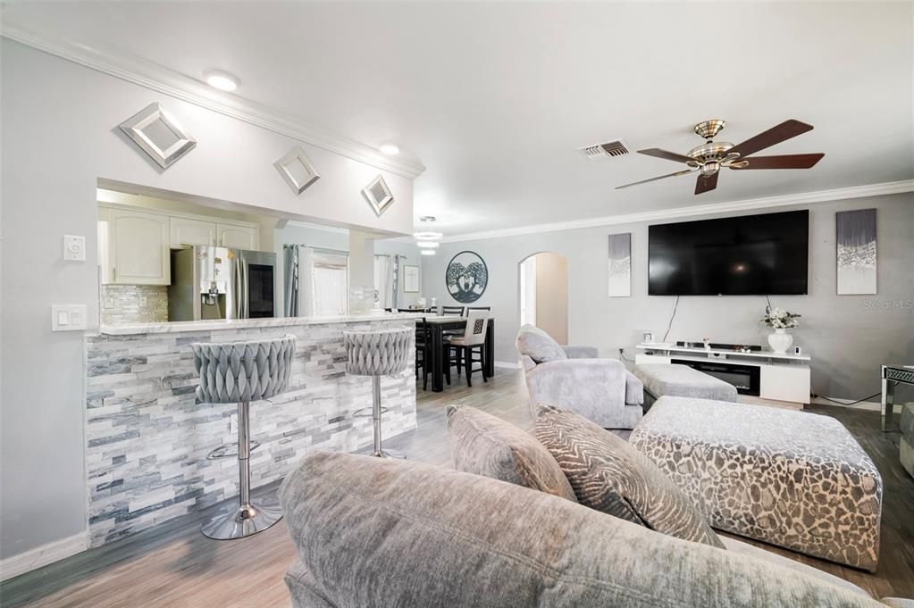 Dining room, Interior, Kitchen, Living room, Recessed Lighting, Stainless Steel Appliances, Wood Texture Flooring
