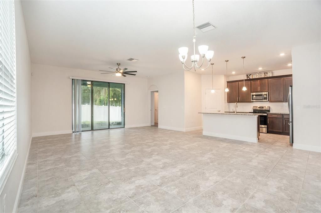 Chandelier, Empty room, Interior, Kitchen, Pendant Lights, Recessed Lighting, Stainless Steel Appliances