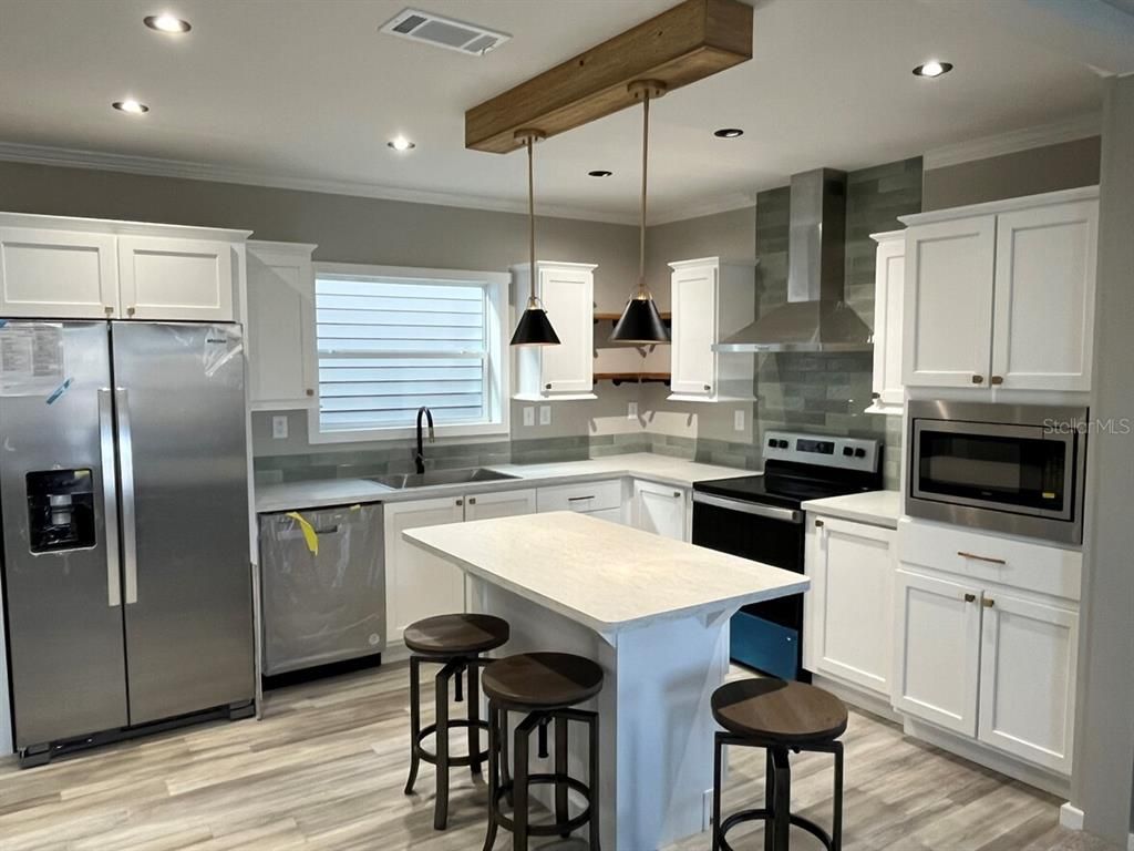 Interior, Kitchen, Pendant Lights, Recessed Lighting, Stainless Steel Appliances, Wood Texture Flooring