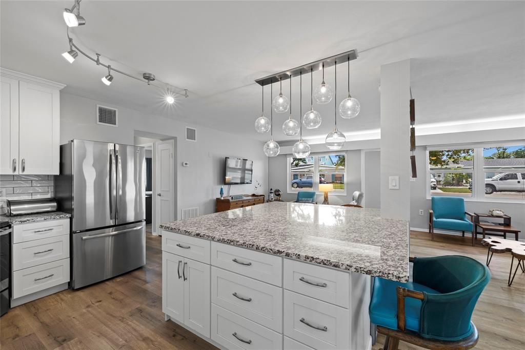 Dining room, Interior, Kitchen, Living room, Pendant Lights, Stainless Steel Appliances, Wood Texture Flooring