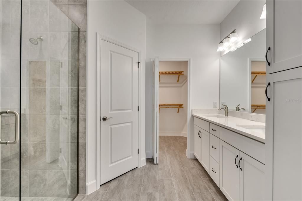 Bathroom, Dual Sink Vanities, Glass Shower, Interior, Walk-in Closets, Wood Texture Flooring