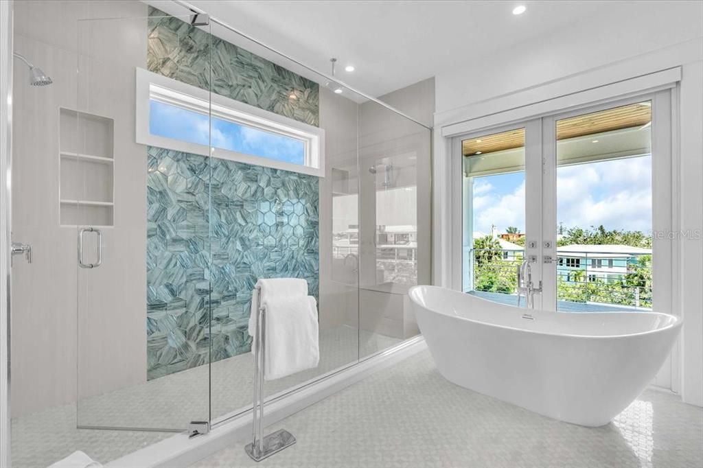 Bathroom, Free Standing Baths, Glass Shower, Interior, Marble Walls, Recessed Lighting, Water