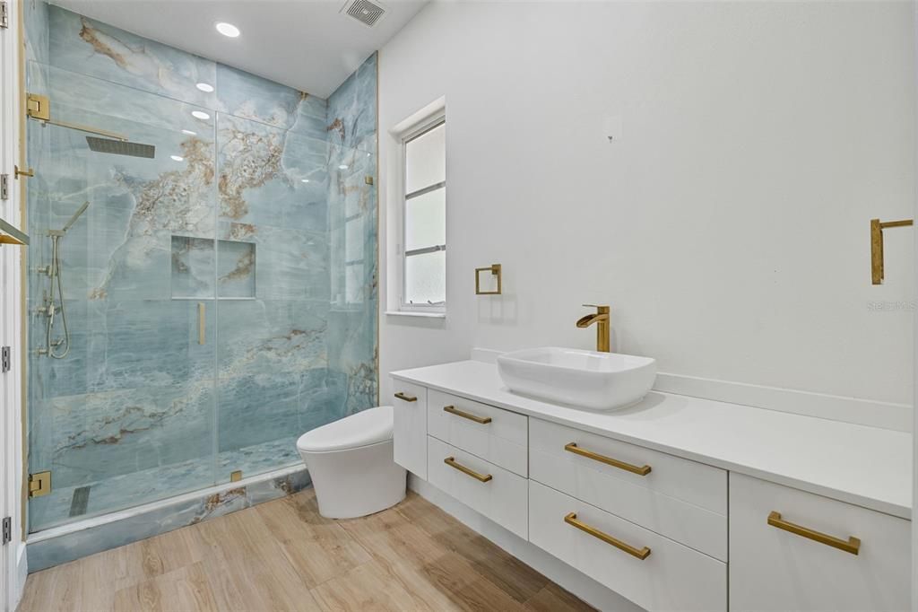 Bathroom, Glass Shower, Interior, Marble Walls, Recessed Lighting, Wood Texture Flooring