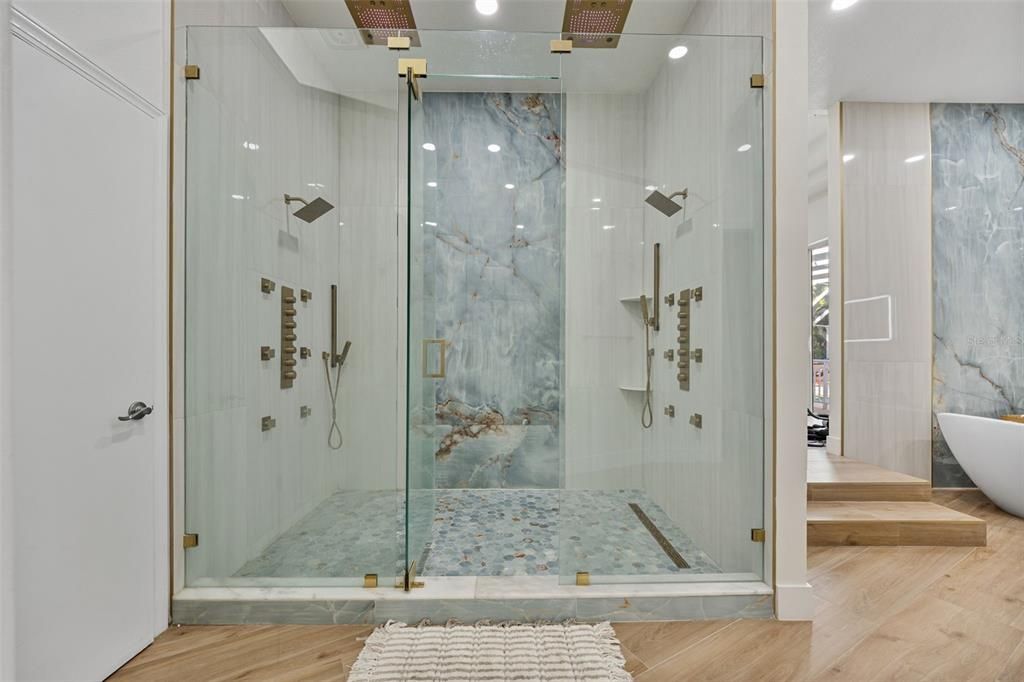 Bathroom, Glass Shower, Interior, Marble Walls, Recessed Lighting, Wood Texture Flooring