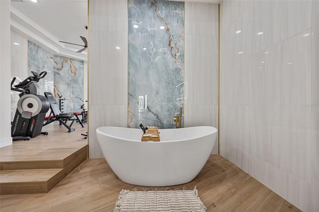 Bathroom, Free Standing Baths, Interior, Marble Walls, Recessed Lighting, Wood Texture Flooring