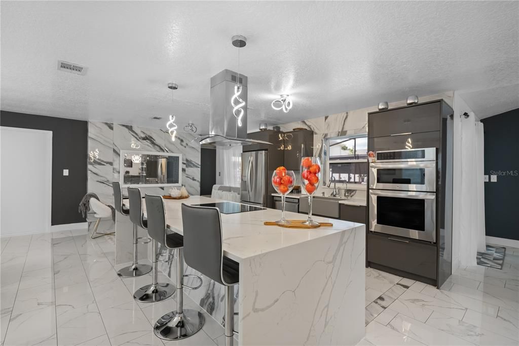 Interior, Kitchen, Marble, Marble Walls, Pendant Lights, Stainless Steel Appliances