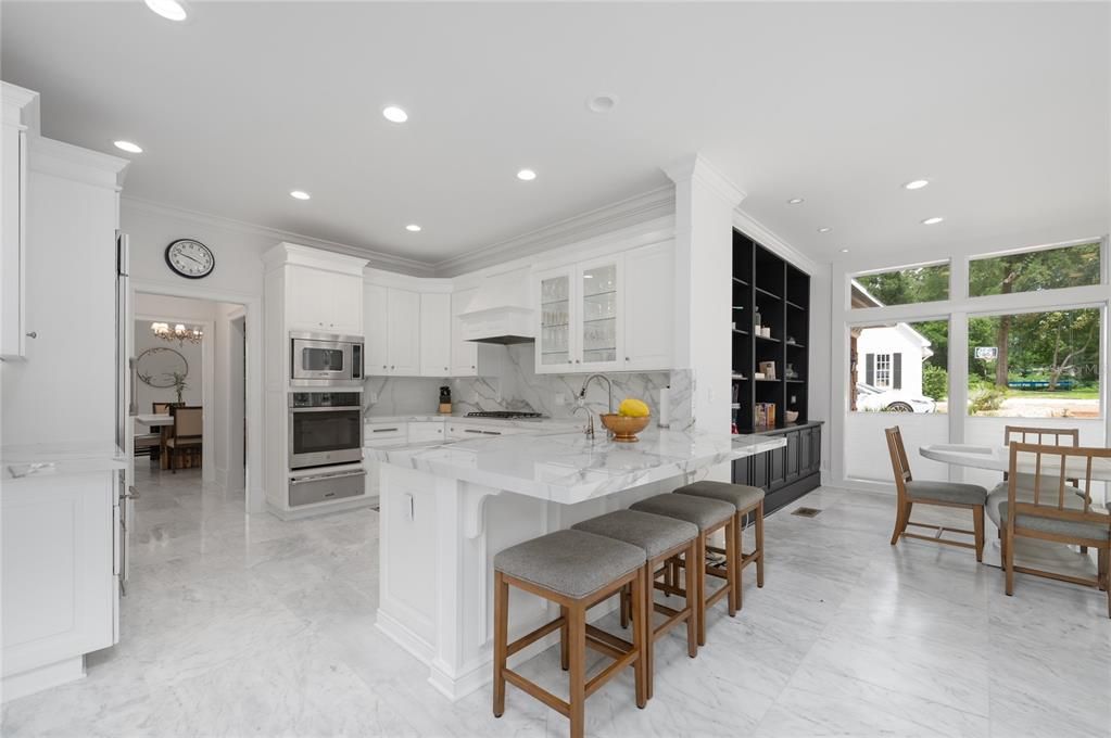 Dining room, Interior, Kitchen, Marble, Marble Walls, Recessed Lighting, Stainless Steel Appliances