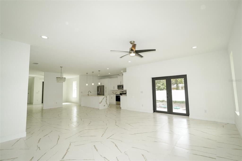Empty room, Interior, Kitchen, Marble, Pendant Lights, Recessed Lighting, Stainless Steel Appliances