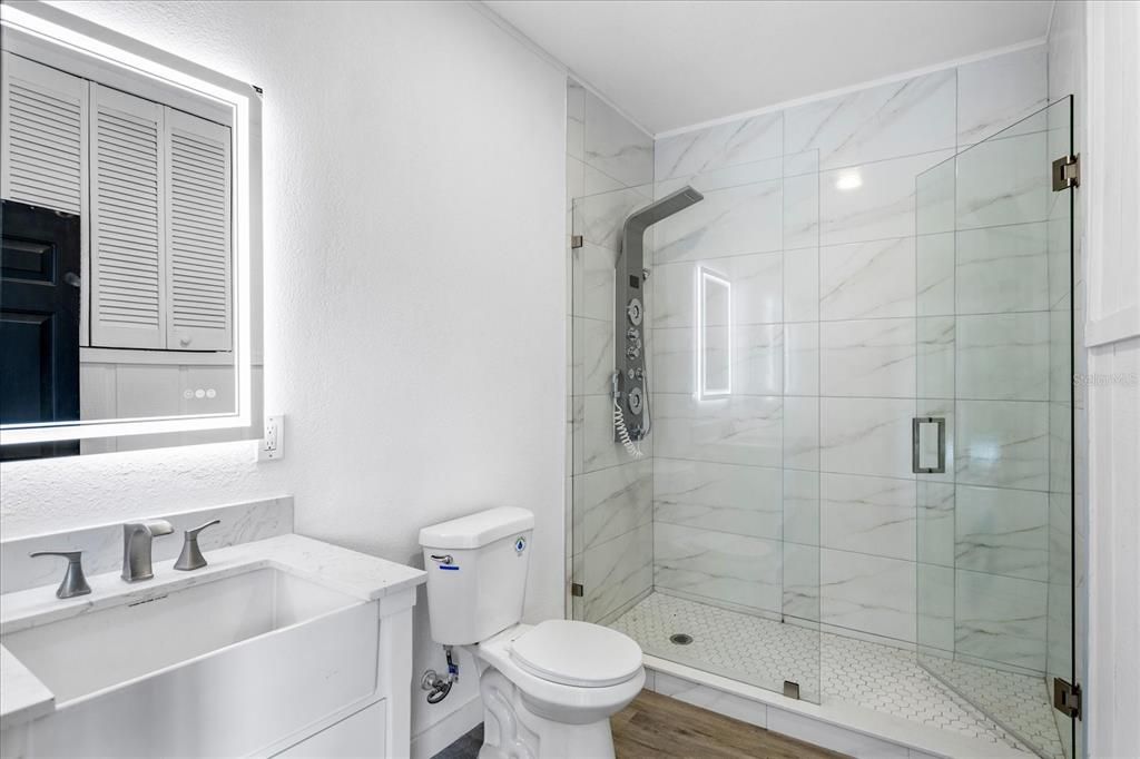 Bathroom, Glass Shower, Interior, Marble Walls, Wood Texture Flooring