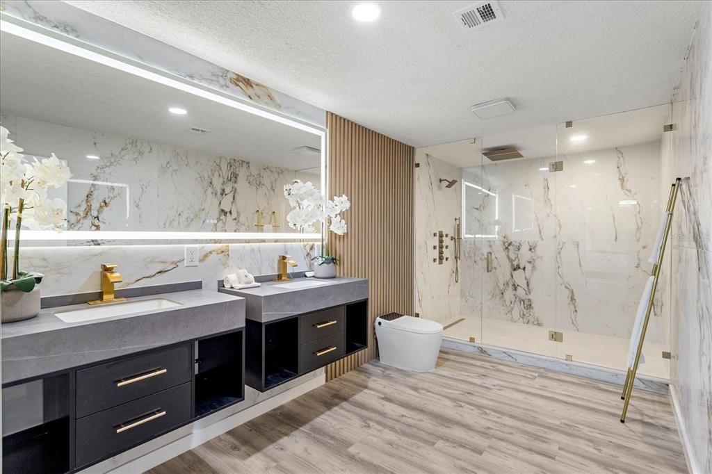 Bathroom, Dual Sink Vanities, Glass Shower, Interior, Marble Walls, Recessed Lighting, Wood Texture Flooring