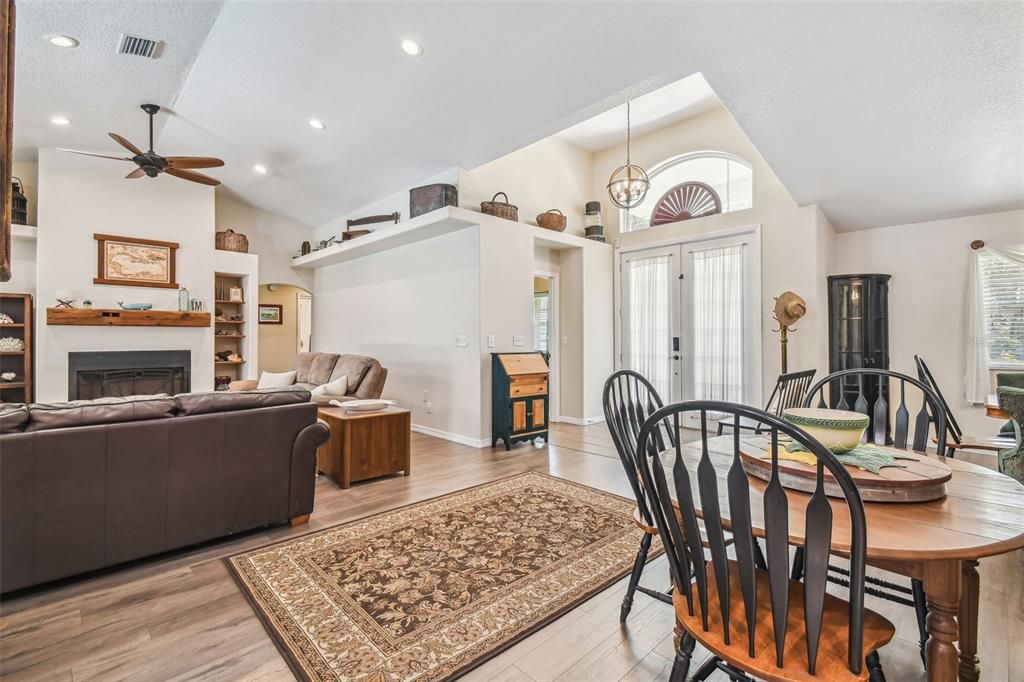 Dining room, Fireplace, Interior, Living room, Pendant Lights, Recessed Lighting, Wood Texture Flooring