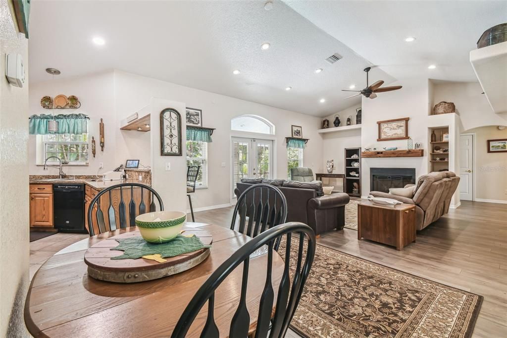 Dining room, Fireplace, Interior, Living room, Recessed Lighting, Wood Texture Flooring