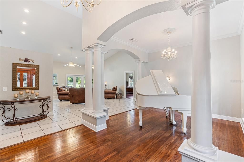 Chandelier, Interior, Living room, Piano, Recessed Lighting, Wood Texture Flooring