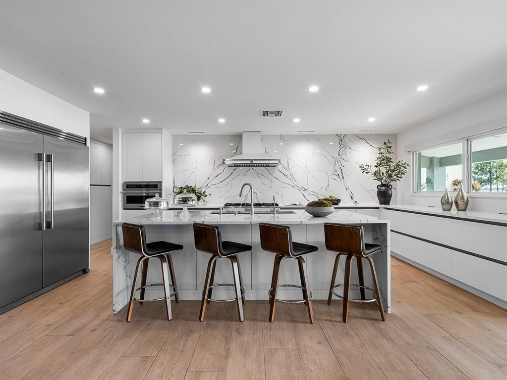 Interior, Kitchen, Marble Walls, Recessed Lighting, Stainless Steel Appliances, Wood Texture Flooring