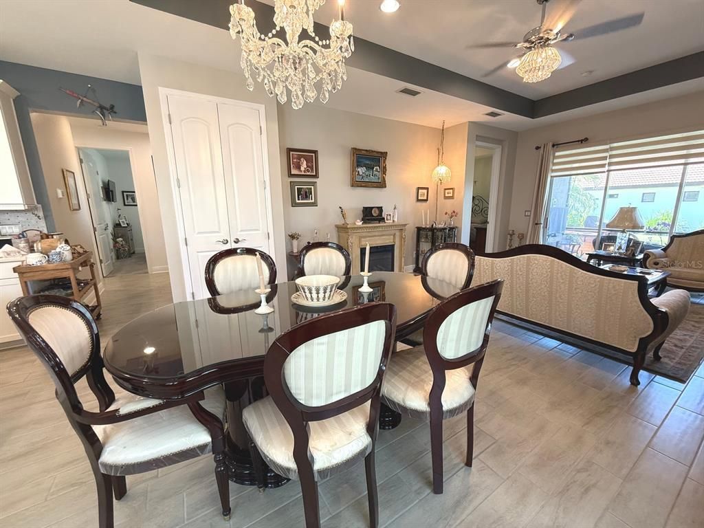 Chandelier, Dining room, Fireplace, Interior, Living room, Recessed Lighting, Wood Texture Flooring