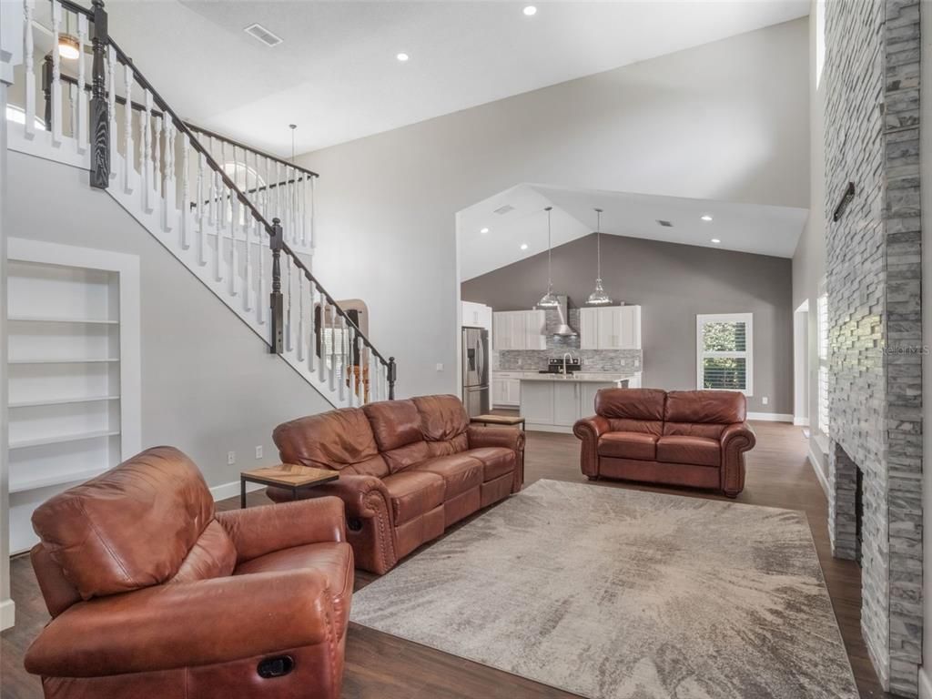 Fireplace, Interior, Living room, Pendant Lights, Recessed Lighting, Stone Walls, Wood Texture Flooring