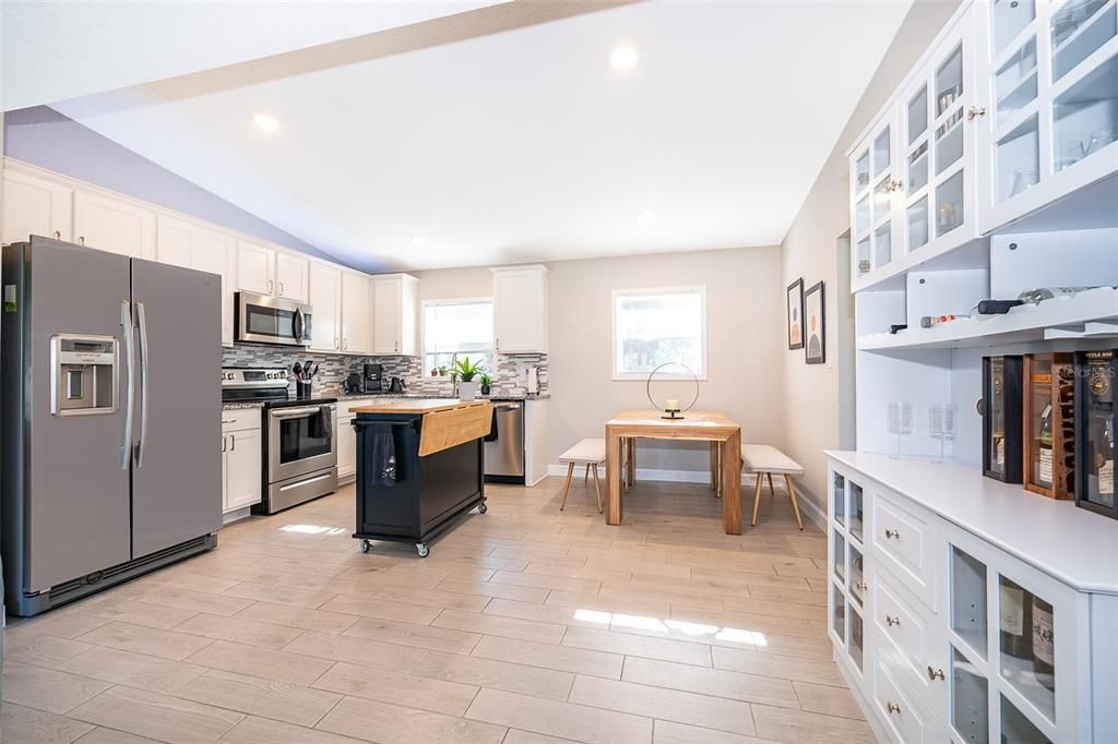 Dining room, Interior, Kitchen, Recessed Lighting, Stainless Steel Appliances, Wood Texture Flooring