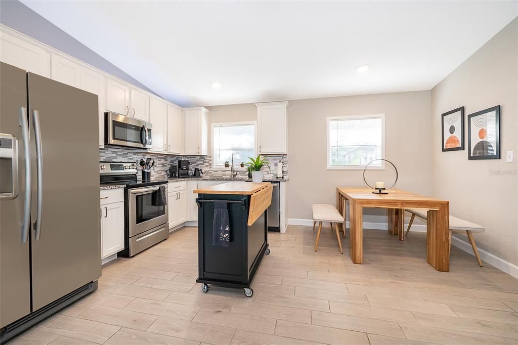 Dining room, Interior, Kitchen, Recessed Lighting, Stainless Steel Appliances, Wood Texture Flooring