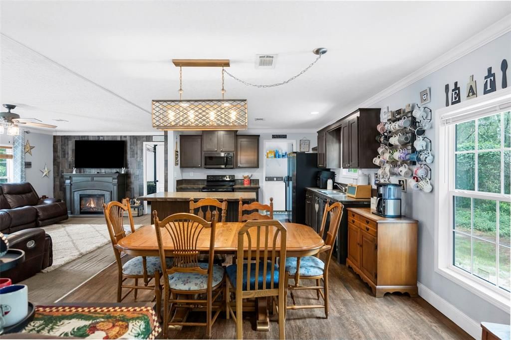 Dining room, Fireplace, Interior, Kitchen, Living room, Pendant Lights, Recessed Lighting, Stainless Steel Appliances, Wood Texture Flooring