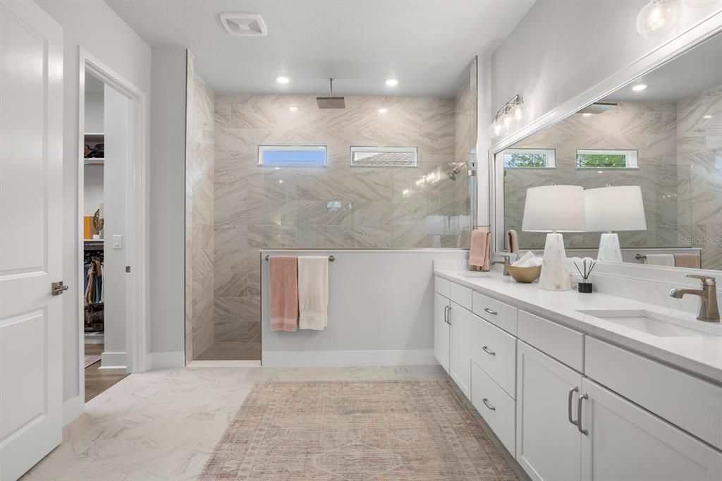 Bathroom, Dual Sink Vanities, Glass Shower, Interior, Marble, Marble Walls, Recessed Lighting
