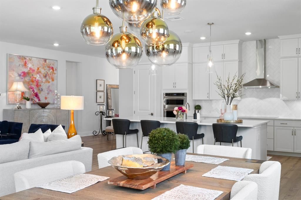 Dining room, Interior, Kitchen, Living room, Pendant Lights, Recessed Lighting, Stainless Steel Appliances, Wood Texture Flooring