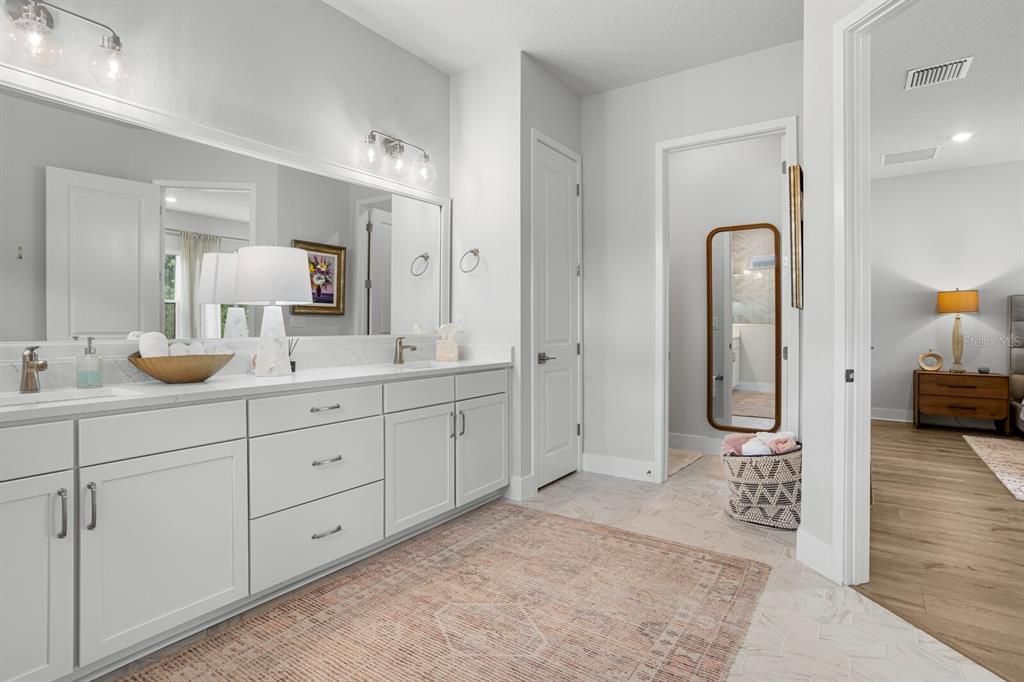 Bathroom, Dual Sink Vanities, Interior, Marble, Recessed Lighting, Wood Texture Flooring