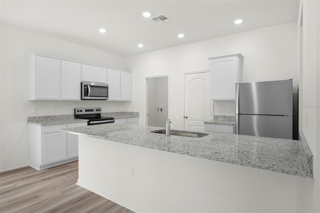 Interior, Kitchen, Recessed Lighting, Stainless Steel Appliances, Wood Texture Flooring