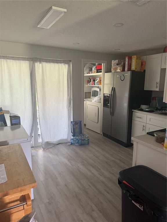 Interior, Kitchen, Recessed Lighting, Washer, Wood Texture Flooring