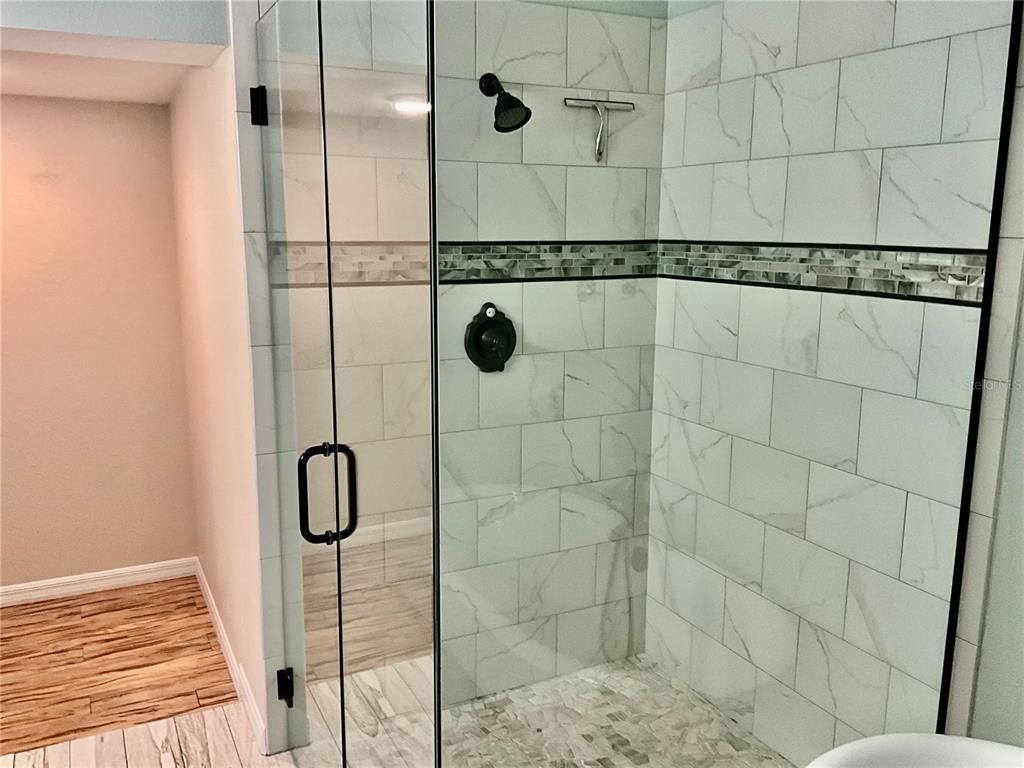 Bathroom, Glass Shower, Interior, Marble Walls, Wood Texture Flooring