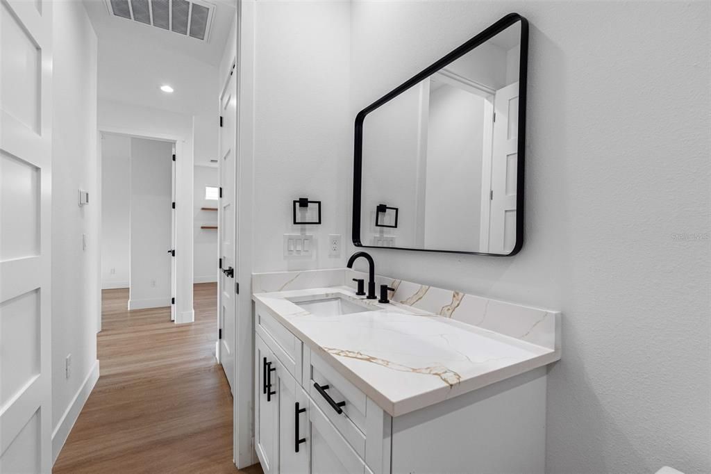 Bathroom, Dual Sink Vanities, Interior, Recessed Lighting, Wood Texture Flooring