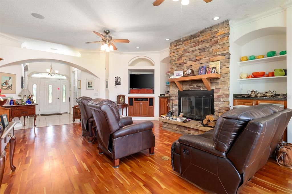 Fireplace, Interior, Living room, Recessed Lighting, Stone Walls, Wood Texture Flooring