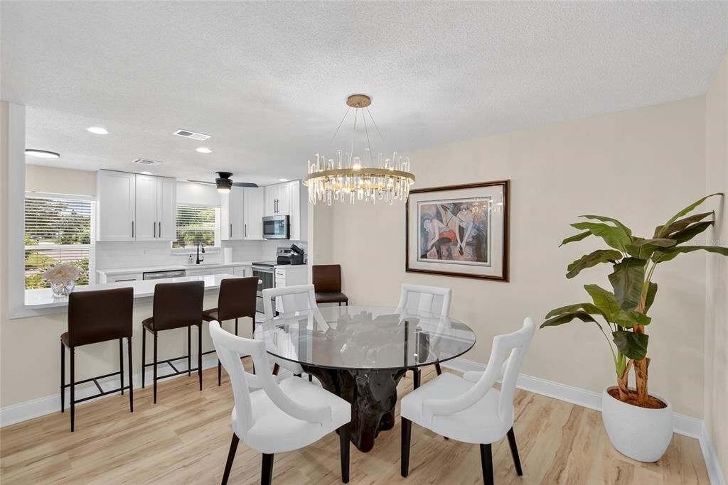 Dining room, Interior, Kitchen, Pendant Lights, Recessed Lighting, Stainless Steel Appliances, Wood Texture Flooring