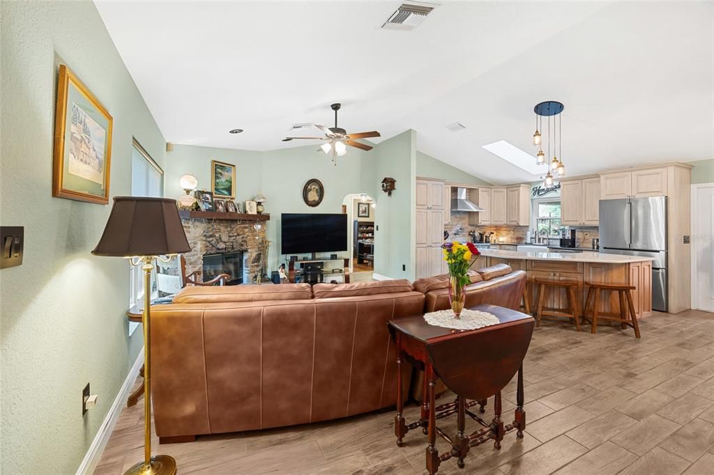 Fireplace, Interior, Kitchen, Living room, Pendant Lights, Stainless Steel Appliances, Wood Texture Flooring