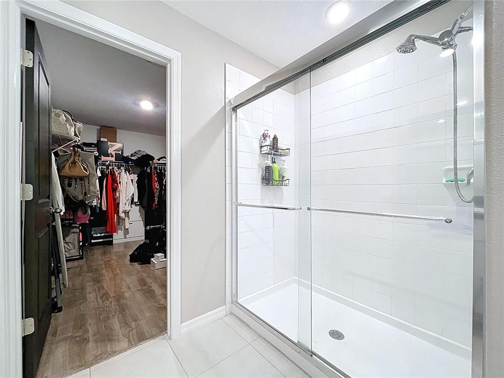 Bathroom, Glass Shower, Interior, Recessed Lighting, Walk-in Closets, Wood Texture Flooring
