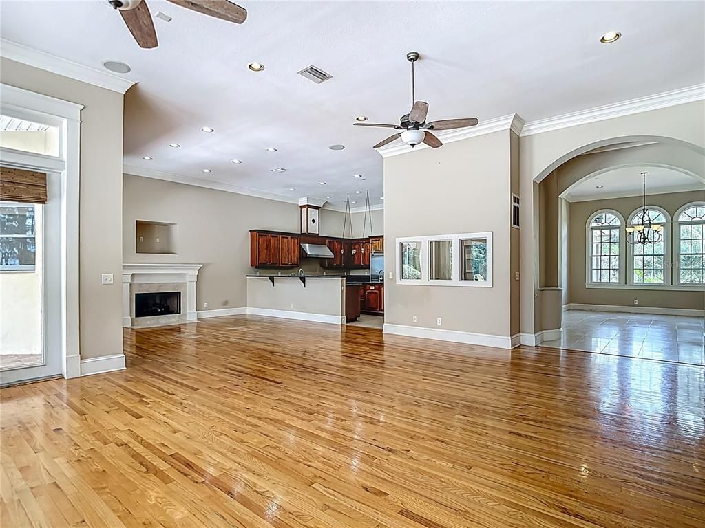 Empty room, Fireplace, Interior, Kitchen, Pendant Lights, Recessed Lighting, Wood Texture Flooring