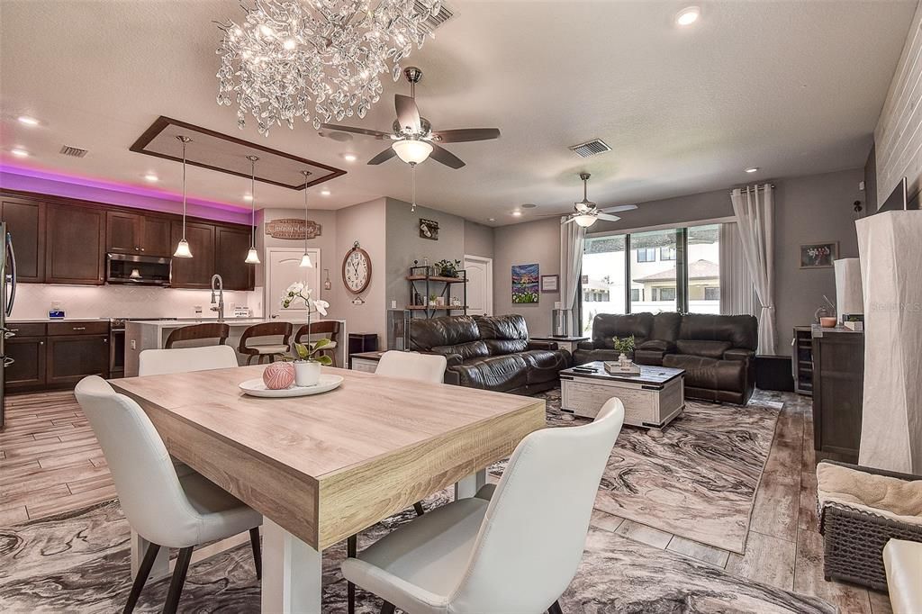 Chandelier, Dining room, Interior, Kitchen, Living room, Marble, Pendant Lights, Recessed Lighting, Stainless Steel Appliances, Wood Texture Flooring