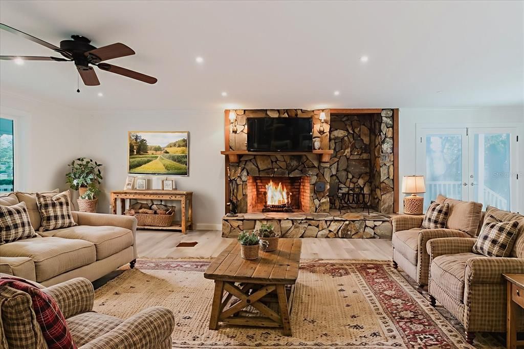 Fireplace, Interior, Living room, Recessed Lighting, Stone Walls, Wood Texture Flooring