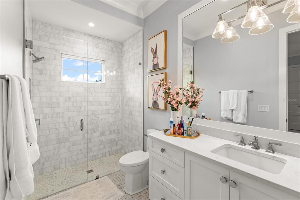 Bathroom, Dual Sink Vanities, Glass Shower, Interior, Recessed Lighting, Stone Walls