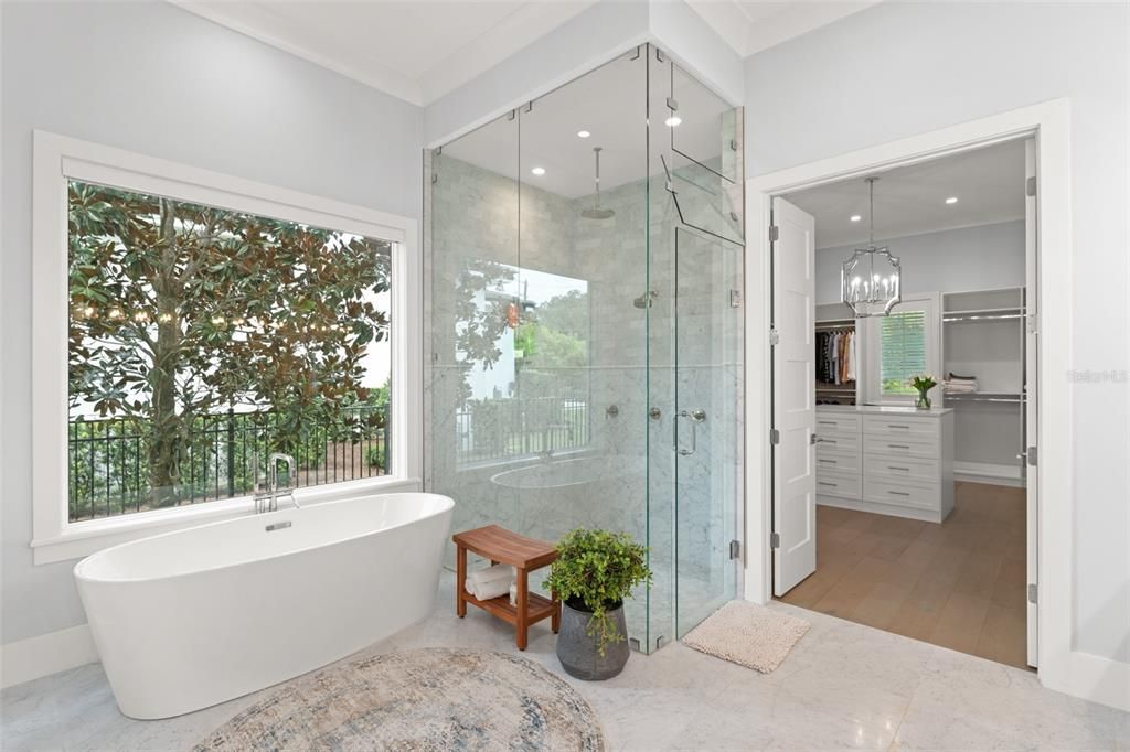 Bathroom, Chandelier, Free Standing Baths, Glass Shower, Interior, Pendant Lights, Recessed Lighting, Wood Texture Flooring