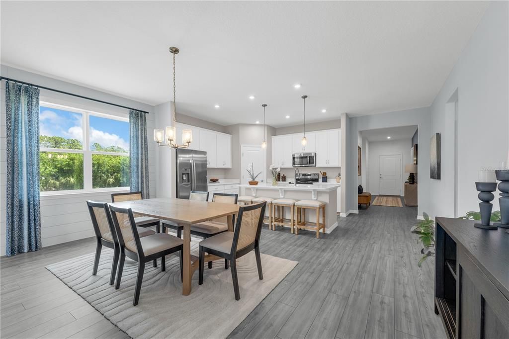 Chandelier, Dining room, Interior, Kitchen, Pendant Lights, Recessed Lighting, Stainless Steel Appliances, Wood Texture Flooring