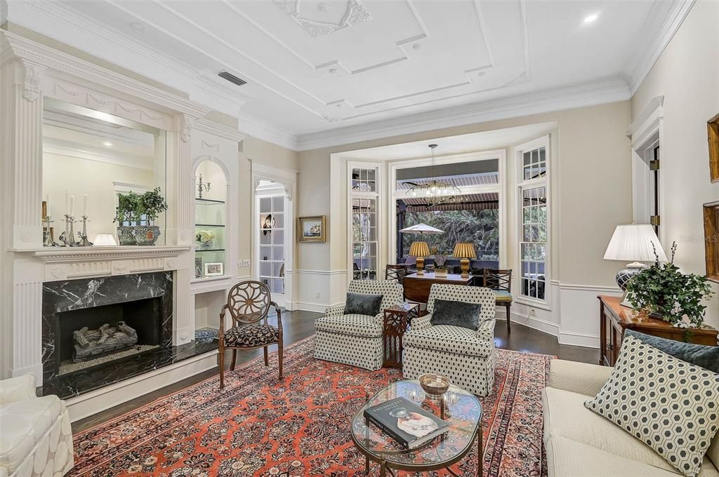 Chandelier, Dining room, Fireplace, Interior, Living room, Pendant Lights, Recessed Lighting, Wood Texture Flooring
