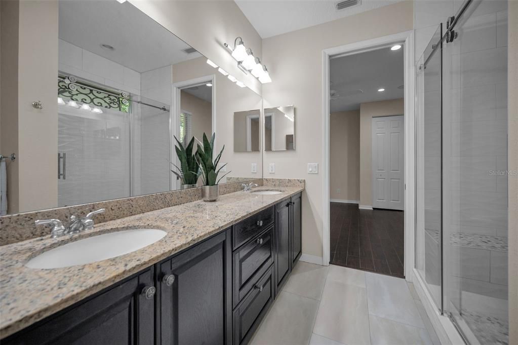 Bathroom, Dual Sink Vanities, Glass Shower, Interior, Recessed Lighting, Wood Texture Flooring
