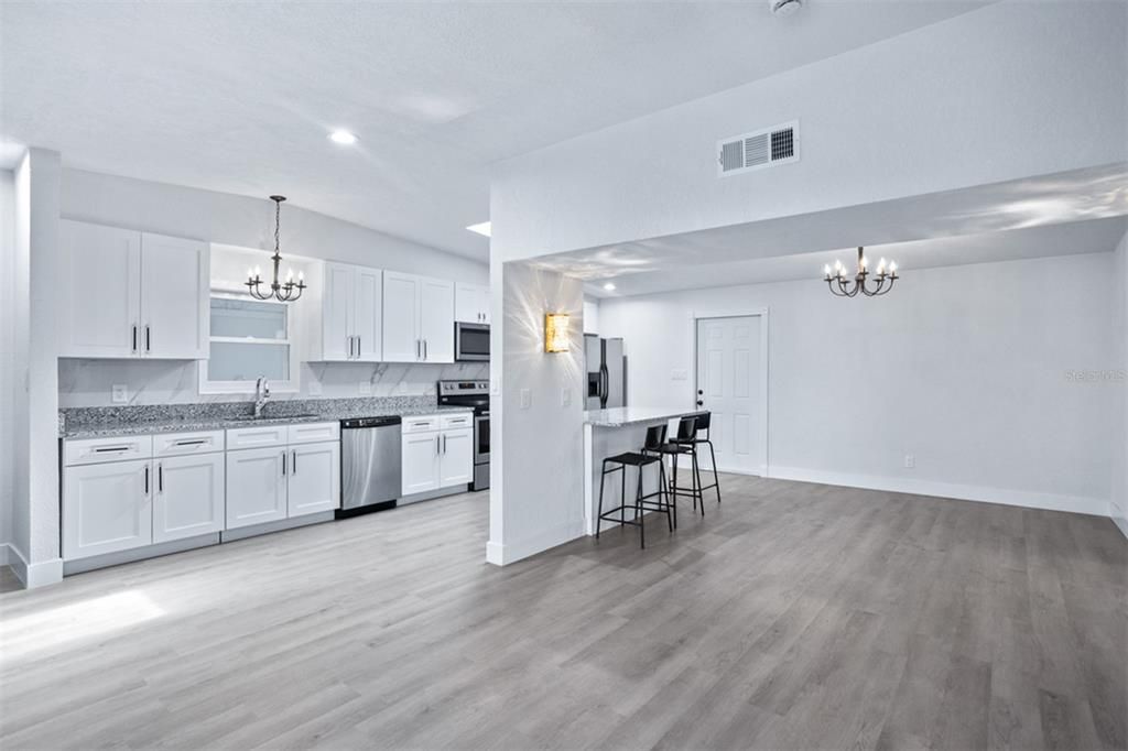 Chandelier, Interior, Kitchen, Recessed Lighting, Stainless Steel Appliances, Wood Texture Flooring