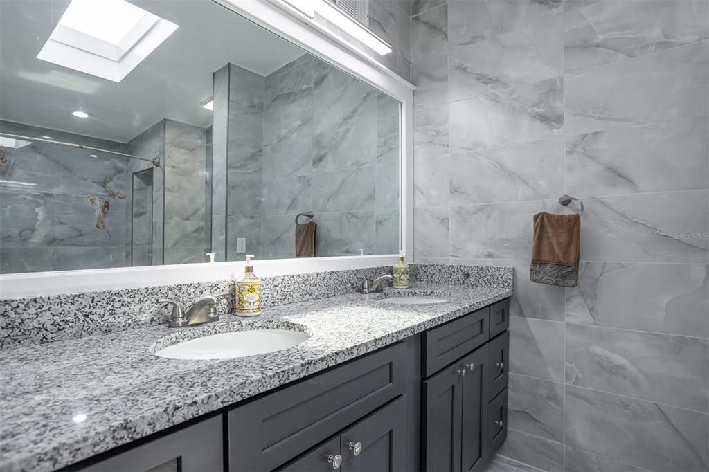 Bathroom, Dual Sink Vanities, Glass Shower, Interior, Marble Walls, Recessed Lighting