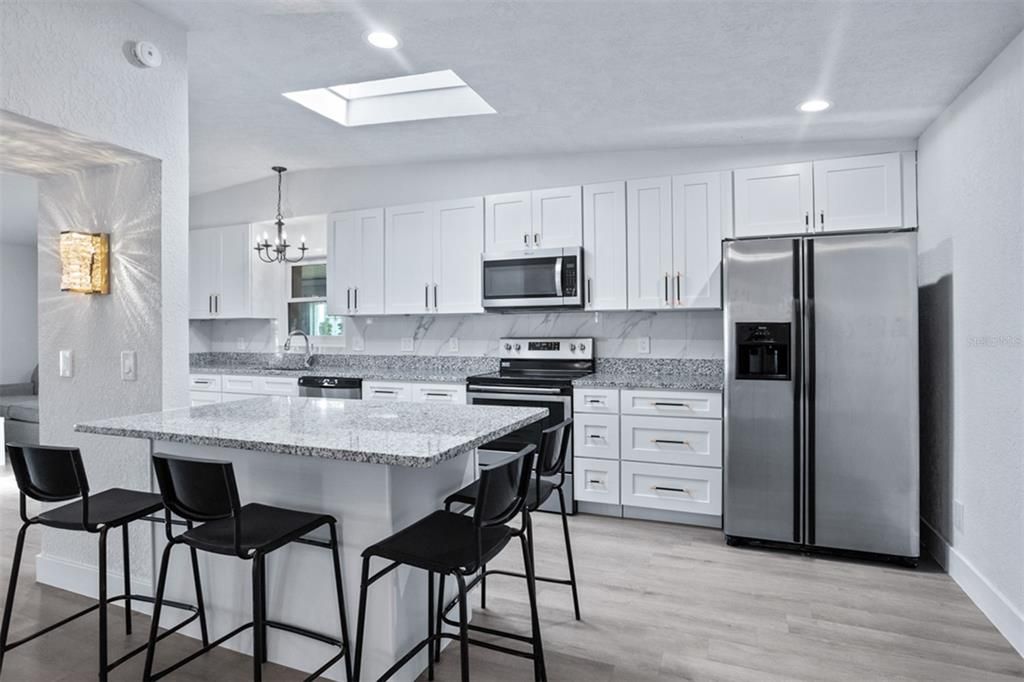 Chandelier, Interior, Kitchen, Recessed Lighting, Stainless Steel Appliances, Wood Texture Flooring