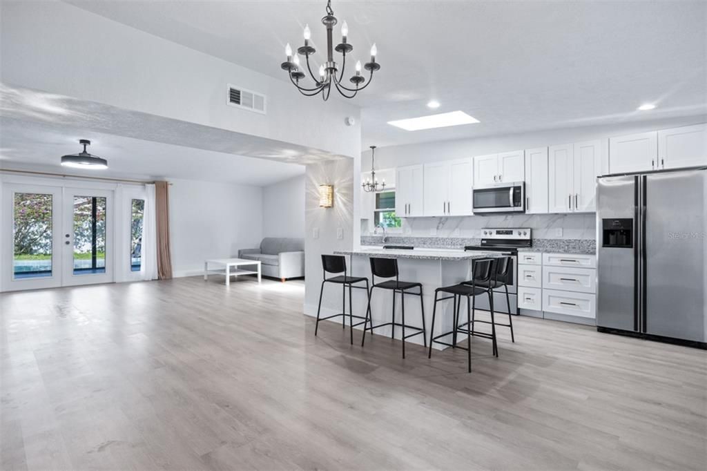 Chandelier, Interior, Kitchen, Pendant Lights, Recessed Lighting, Stainless Steel Appliances, Wood Texture Flooring