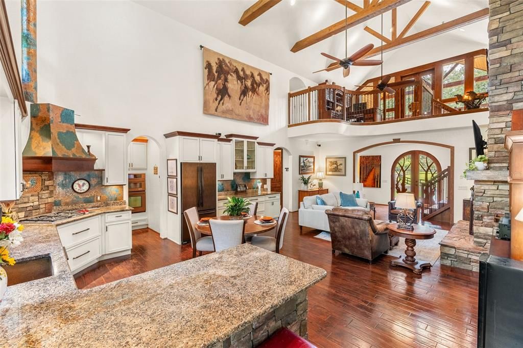 Dining room, Fireplace, Interior, Kitchen, Living room, Pendant Lights, Stone Walls, Wooden Beams, Wood Texture Flooring