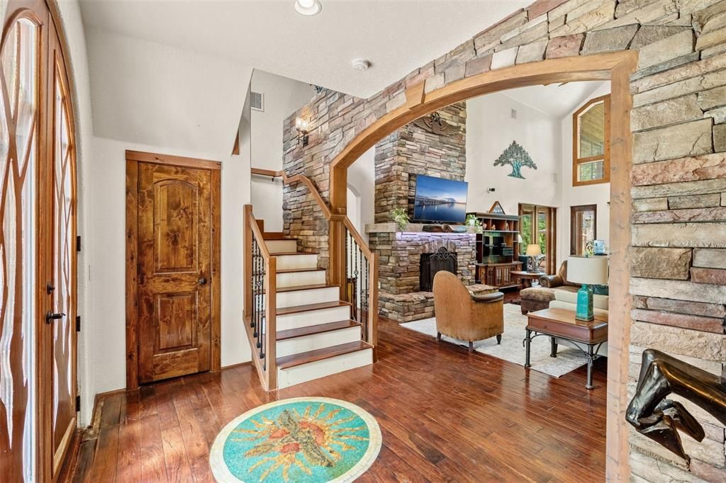 Fireplace, Interior, Living room, Recessed Lighting, Stone Walls, Wood Texture Flooring