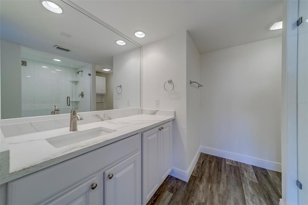 Bathroom, Dual Sink Vanities, Glass Shower, Interior, Recessed Lighting, Wood Texture Flooring