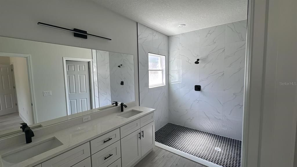 Bathroom, Dual Sink Vanities, Interior, Marble Walls, Wood Texture Flooring